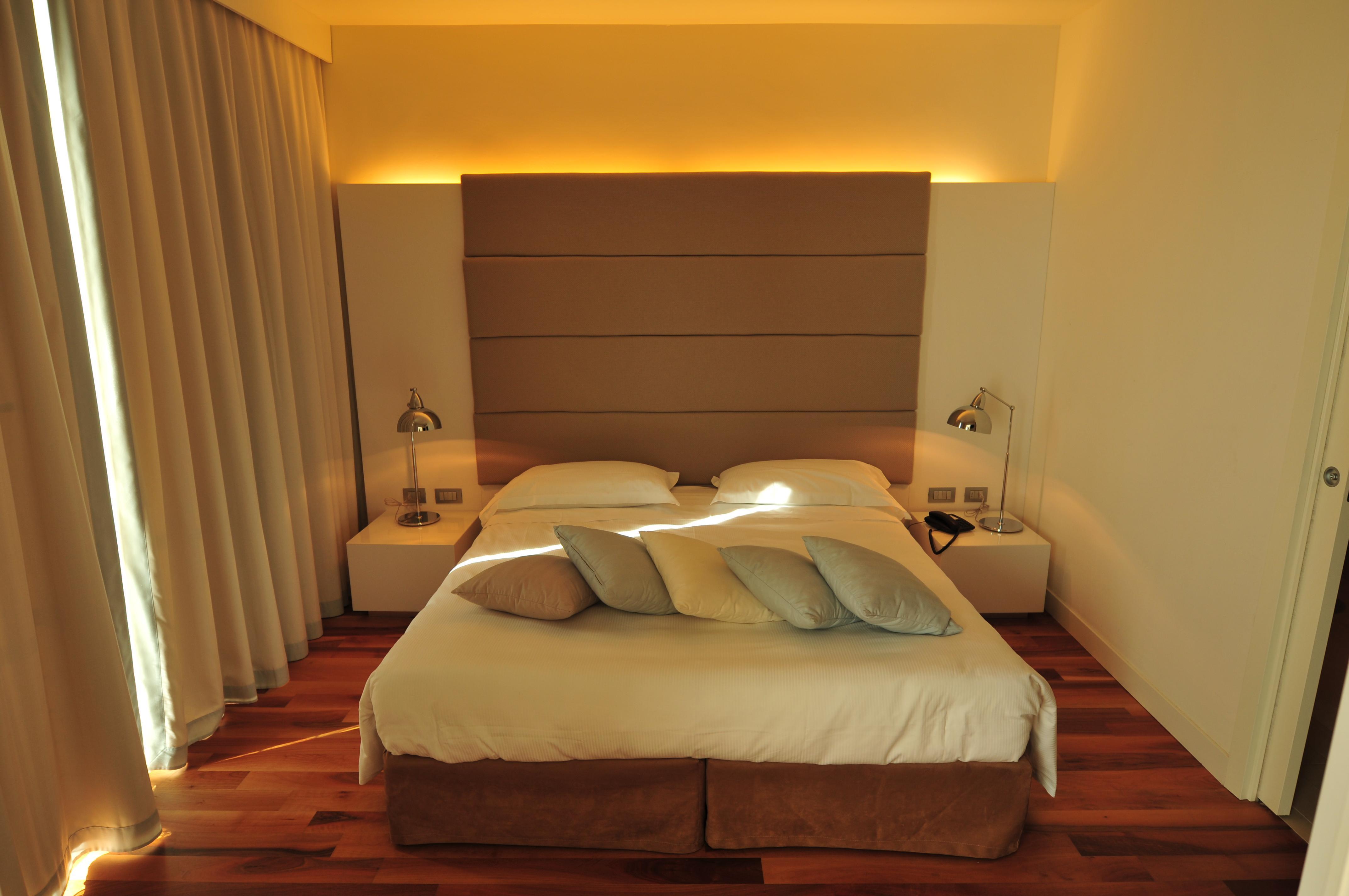 Pisa Tower Plaza Hotel Bagian luar foto A bedroom